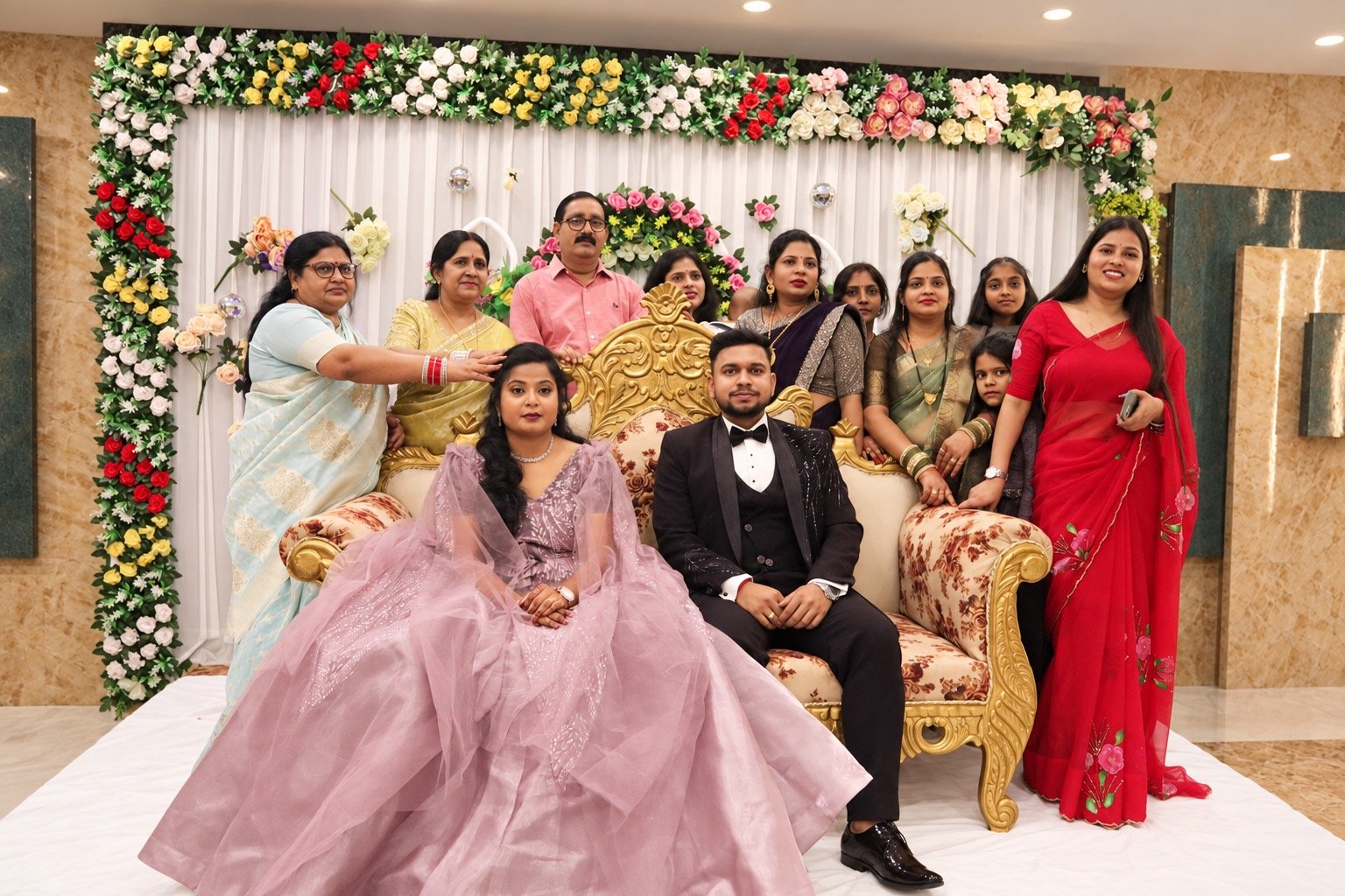 Family gathered around Dipali and Anurag